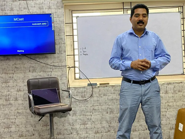 Trainer presenting to a small group in the training room