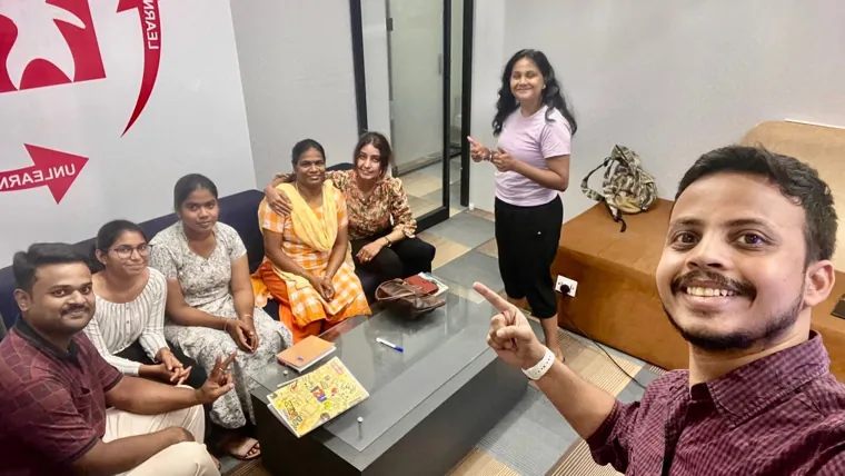 Participants and trainer taking a group selfie after a session