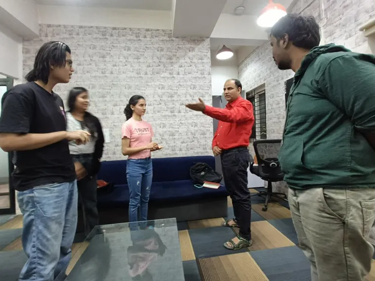 Participants on their feet during a group communication exercise