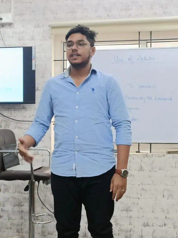 Young professional practising a talk in front of the whiteboard