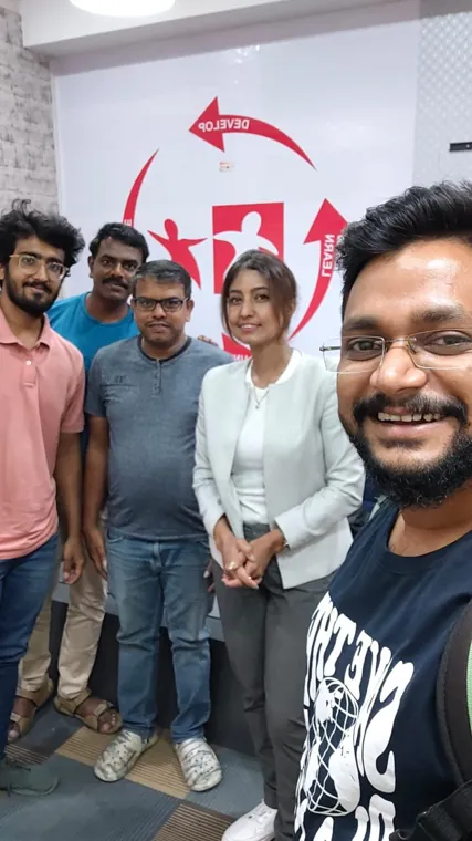 Group selfie with the trainer at the centre
