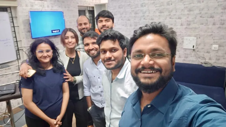 Participants gathered with the trainer for a group photo
