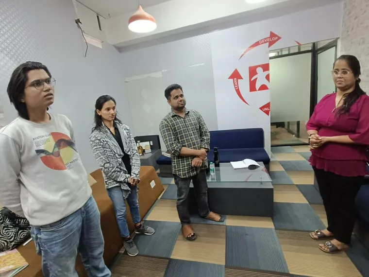 Trainer taking questions from participants in the training room